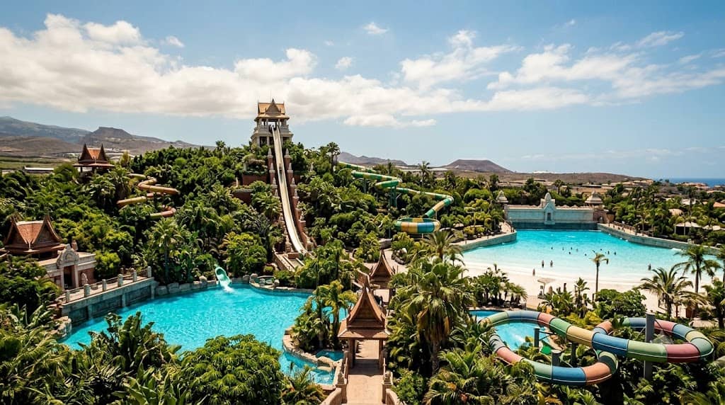 Siam Park Tenerife water slide tower with turquoise water pools and tropical palms